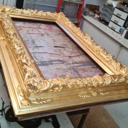 Gold gilded ornate picture frame.
