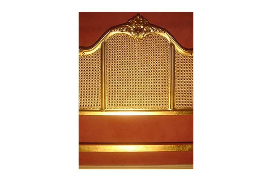 Gilded bed frame.