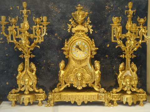 A gilded french clock set