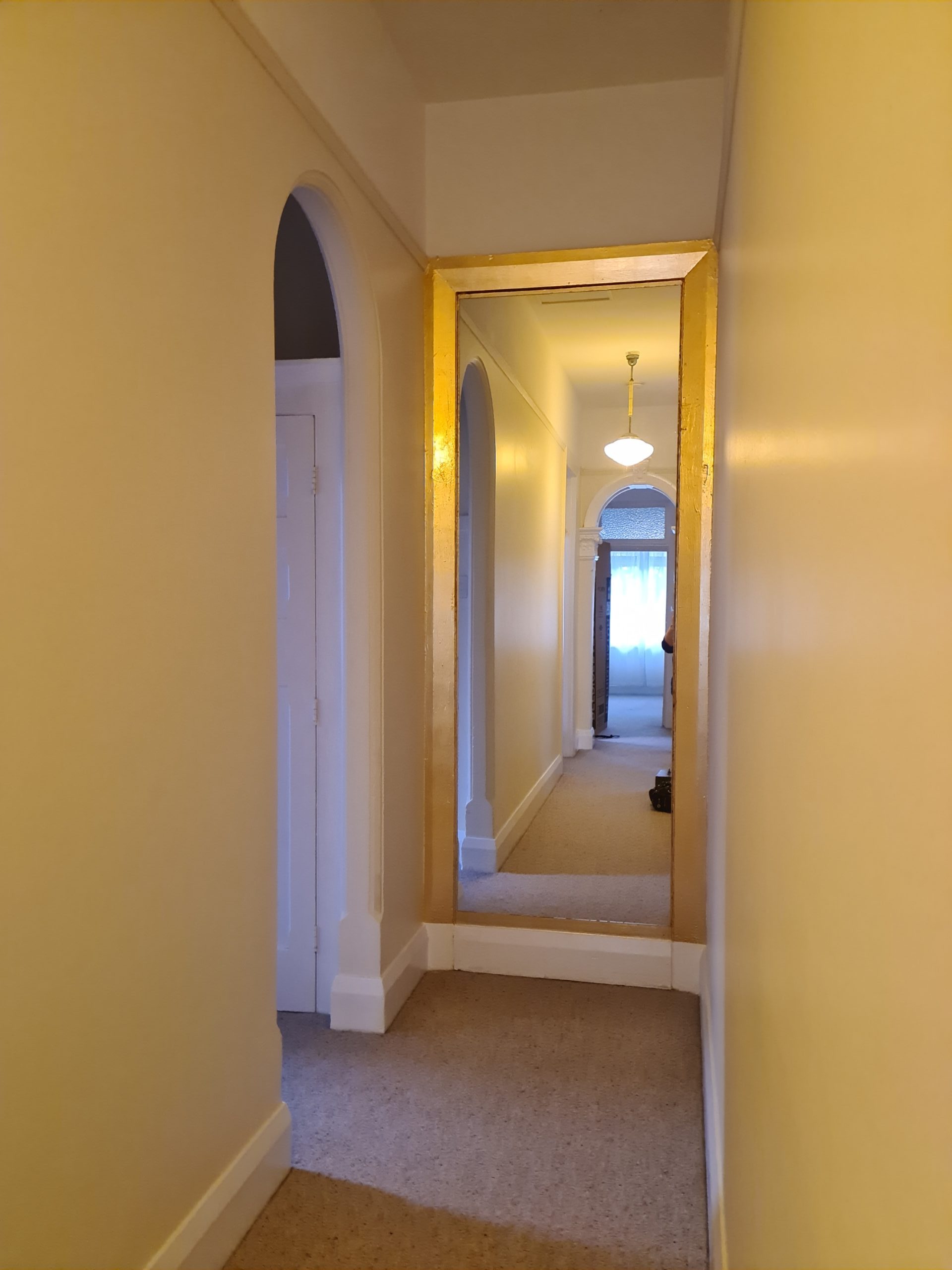 A gold gilded hallway frame