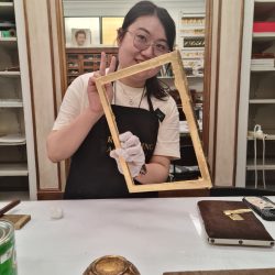 A student learning gilding during the Art Gilding Masterclass.