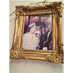 Gilded picture frame of Brigitte with The Queen.