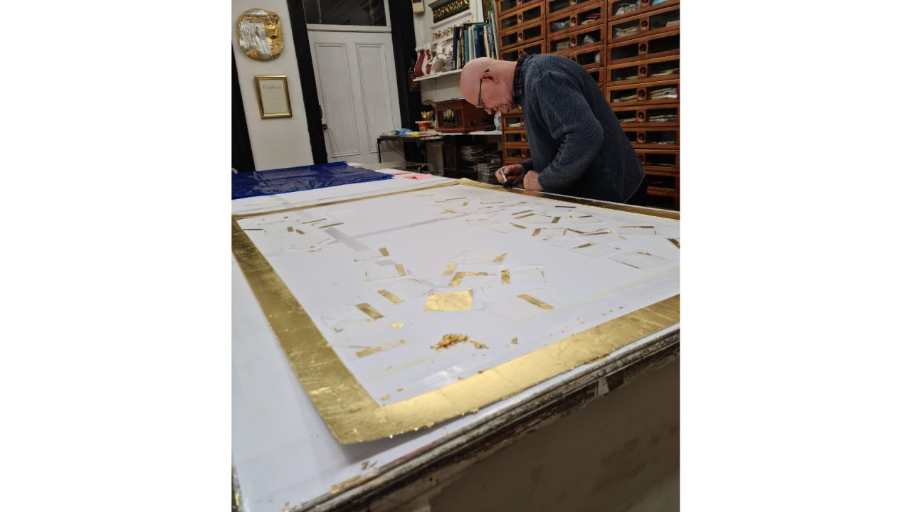 Karl gilding with gold leaf.