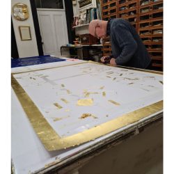 Karl gilding with gold leaf.
