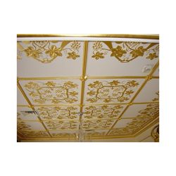A gold gilded white ceiling.