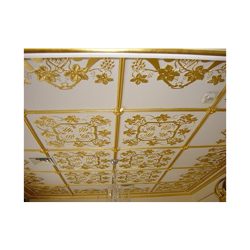 A gold gilded white ceiling.