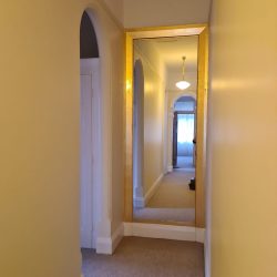 A gold gilded hallway frame