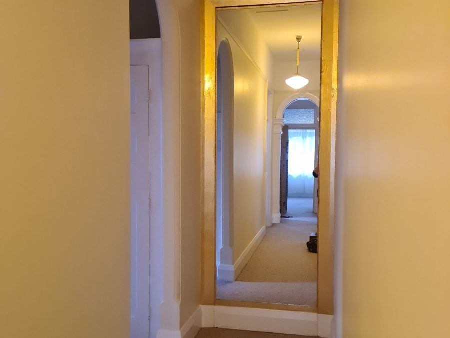 A gold gilded hallway frame