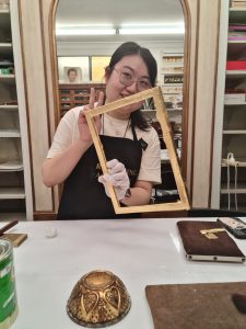 A student learning gilding during the Art Gilding Masterclass.