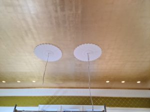 Faux gold leaf over a sprawling 30-square-meter ceiling.