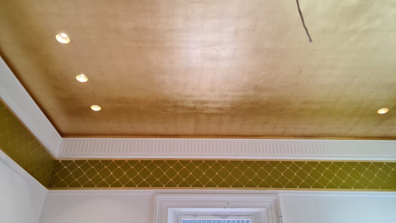 Faux gold leaf over a sprawling 30-square-meter ceiling.