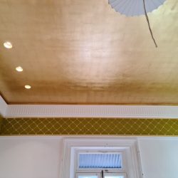 Faux gold leaf over a sprawling 30-square-meter ceiling.