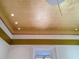Faux gold leaf over a sprawling 30-square-meter ceiling.
