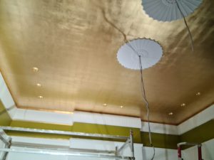 Faux gold leaf over a sprawling 30-square-meter ceiling.
