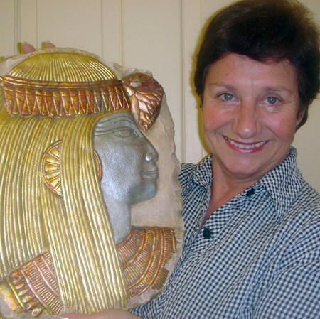 Brigitte Eggert with a gilded Egyptian plaque